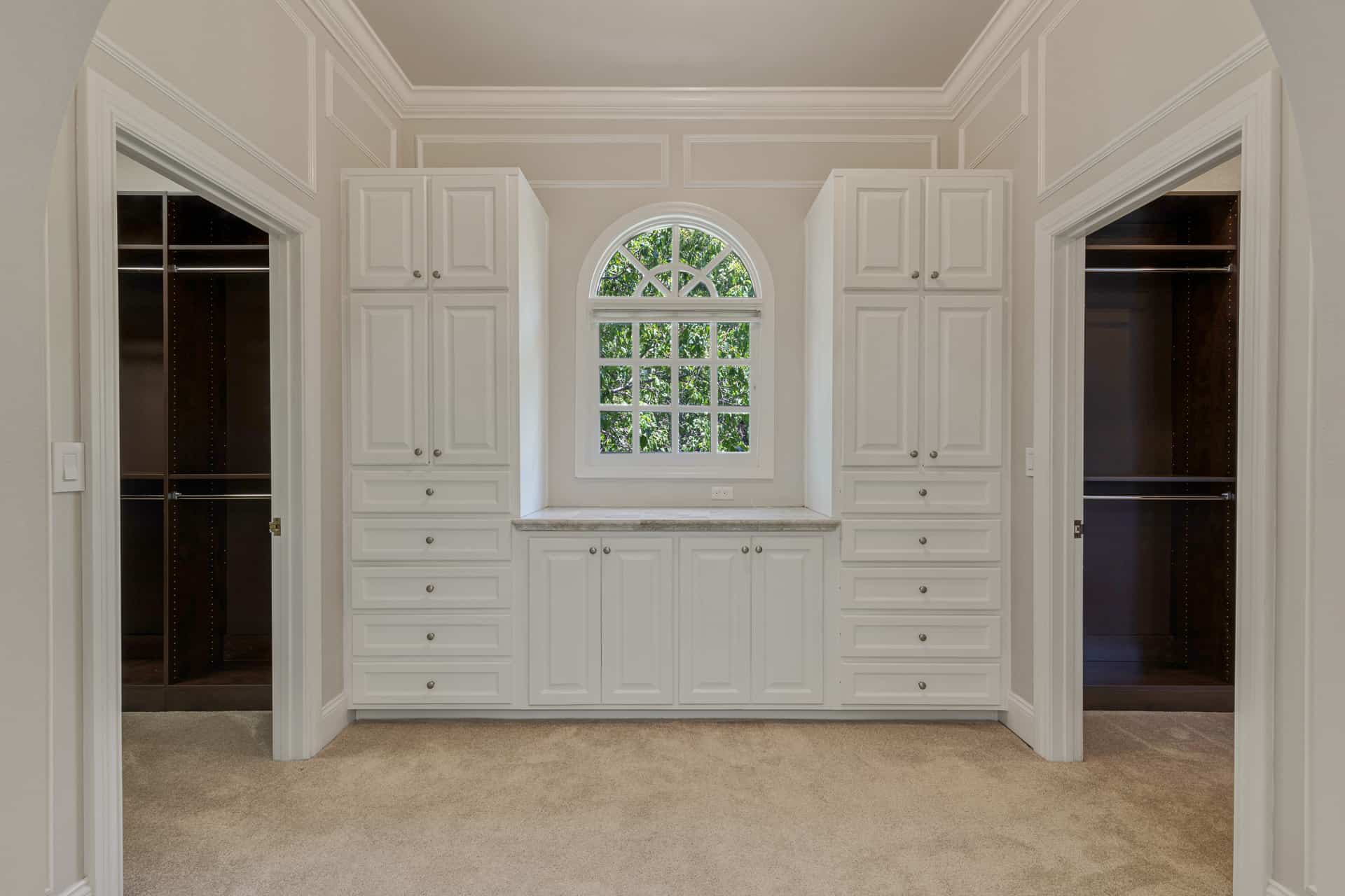 entry to dual walk-in closets in owner's suite
