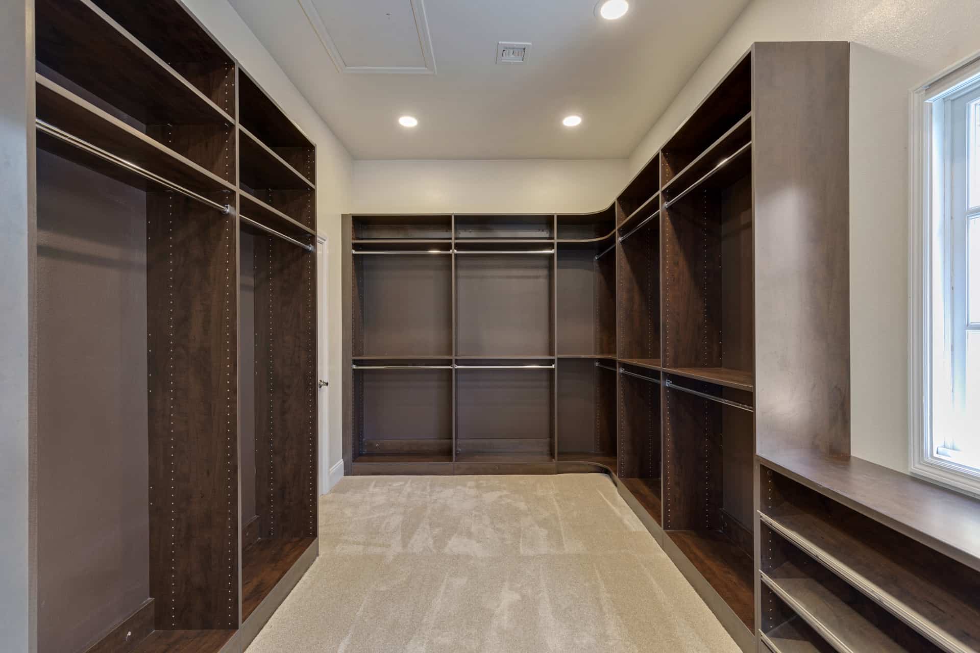 larger of the two walk-in closets