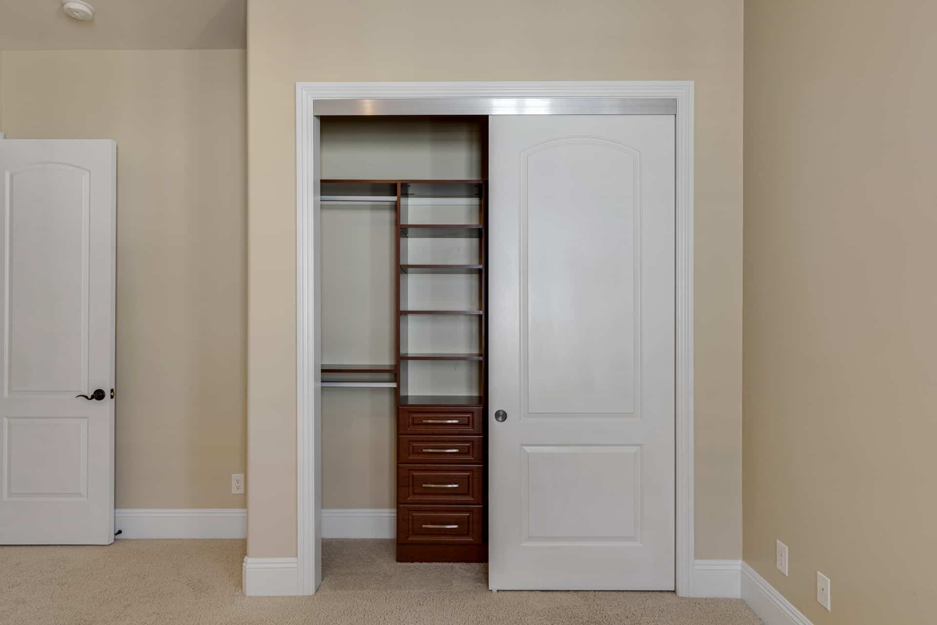closet with custom built ins, found in all secondary bedrooms