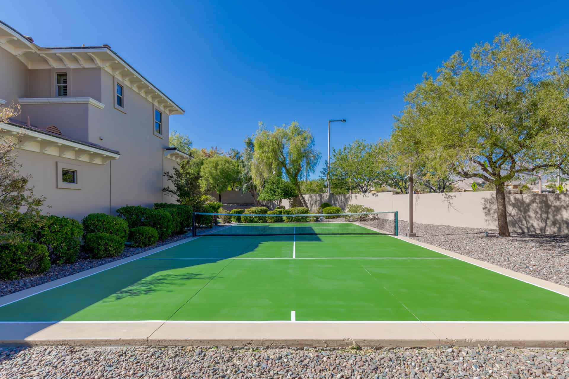On the North side of the property you'll find a private tennis court, which has been recently repainted and includes floodlights.